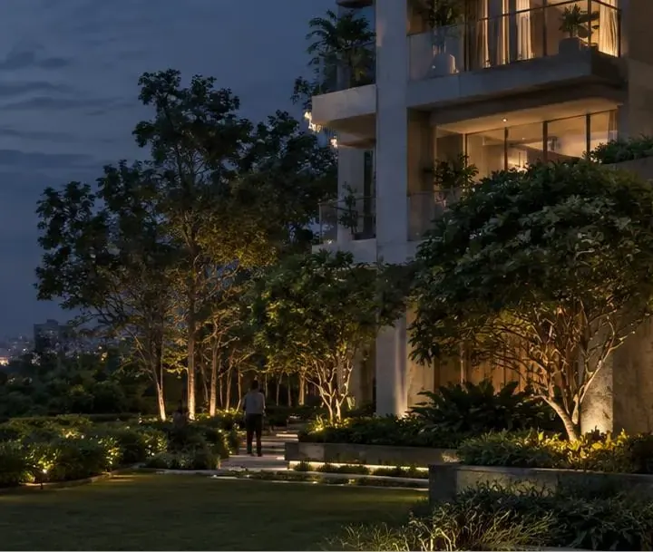 A contemporary Vistara residence framed by mature trees at dusk